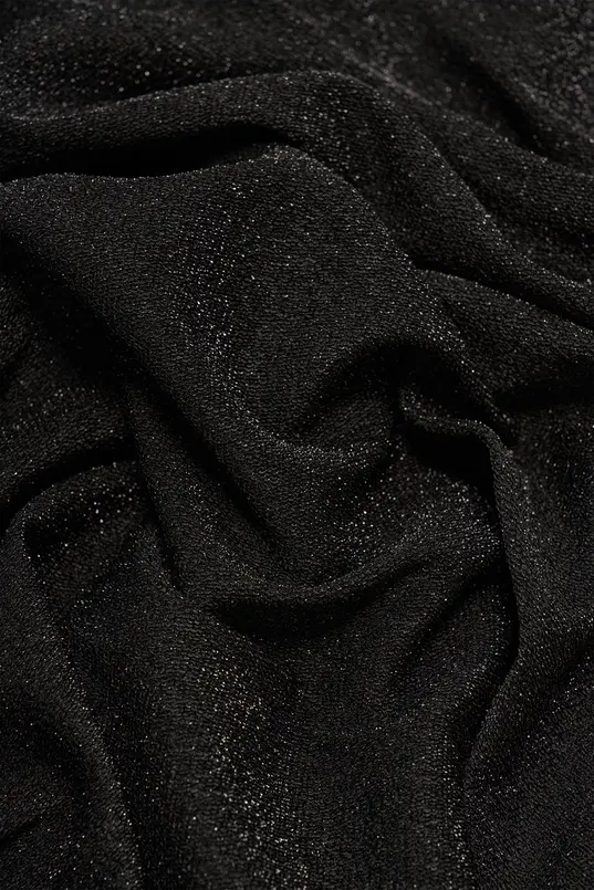 Glitterjurk met knoopdetail